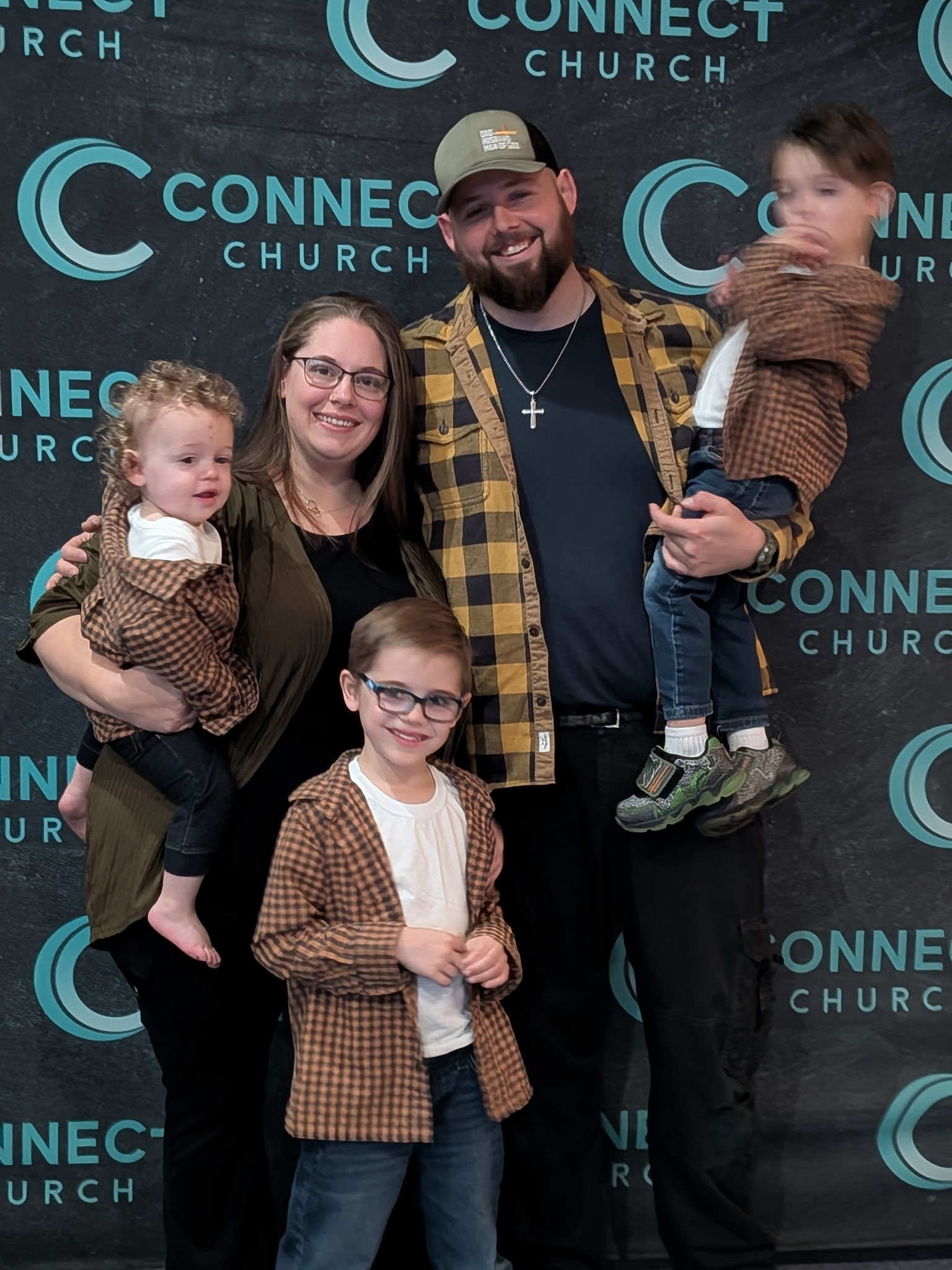 A Connect Church family celebrating Child Dedication