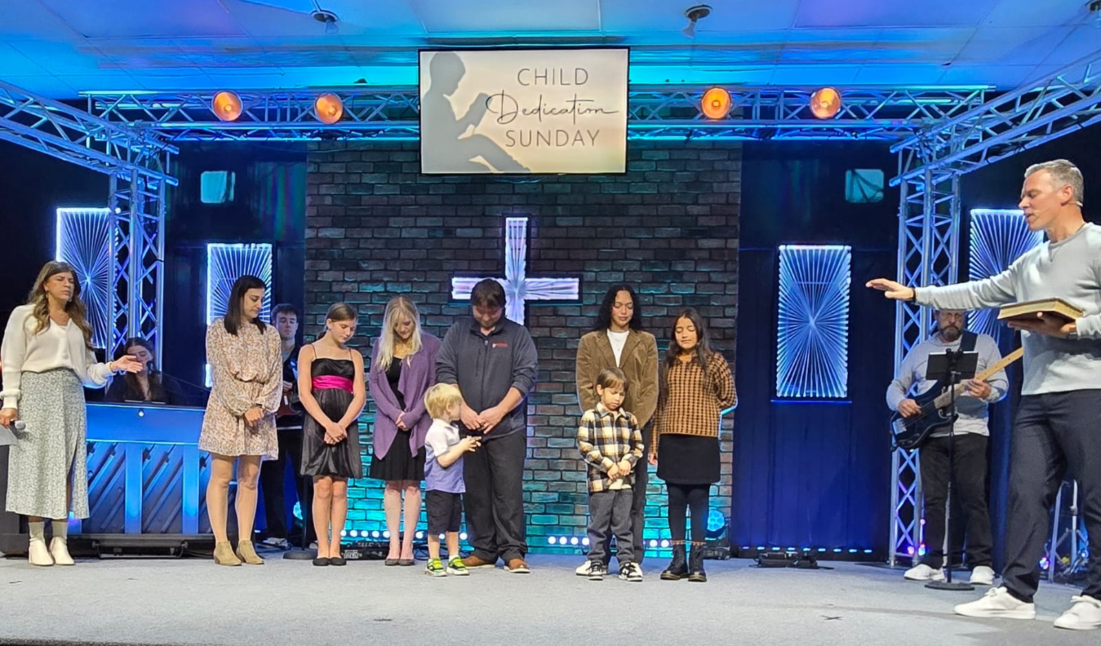 Connect Church families gathered on stage for Child Dedication Sunday